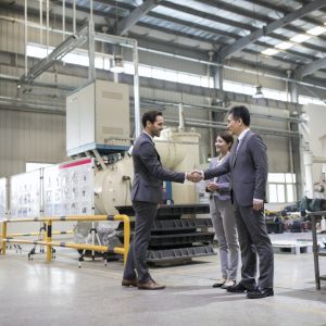 business-people-shaking-hands-in-the-factory.jpg